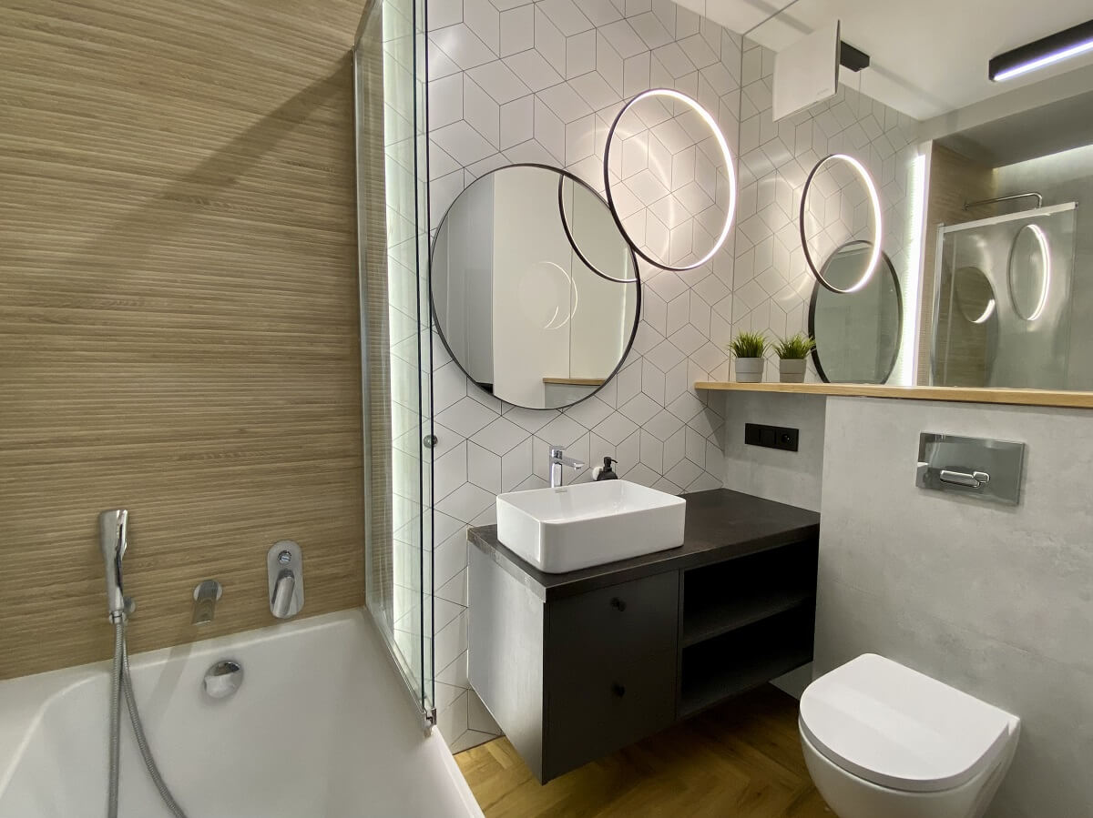 łazienka płytki heksagony łazienka loft okrągła lampa okrągłe lustro w łazience